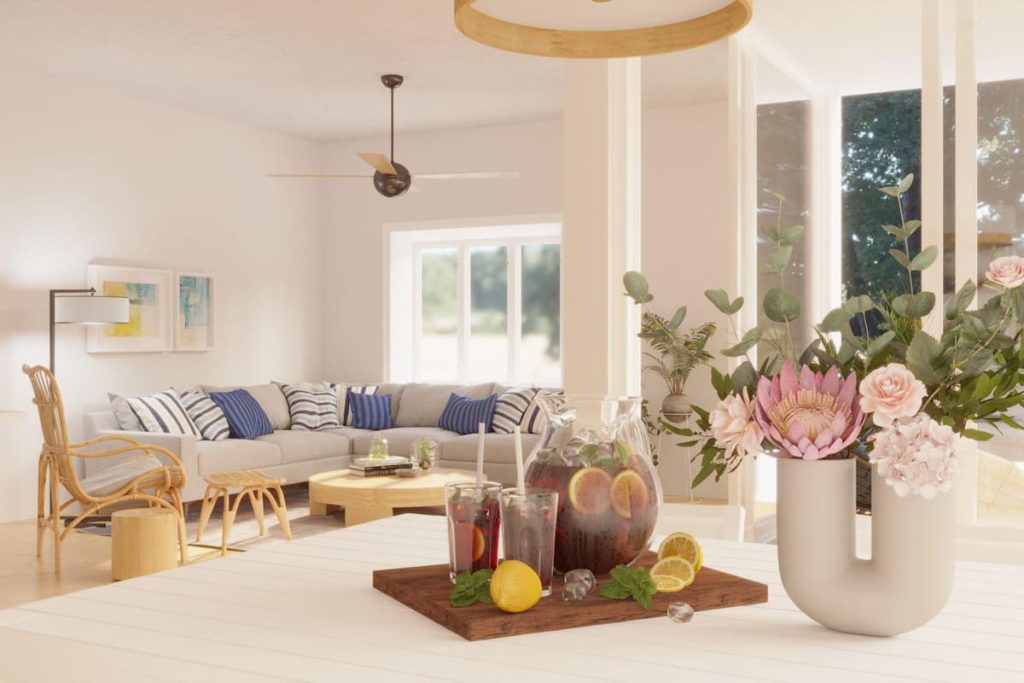 Bright Hamptons style living room featuring a neutral linen sofa, wooden coffee table, and coastal decor with blue accents